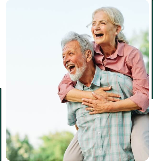 elderly couple having fun in the garden