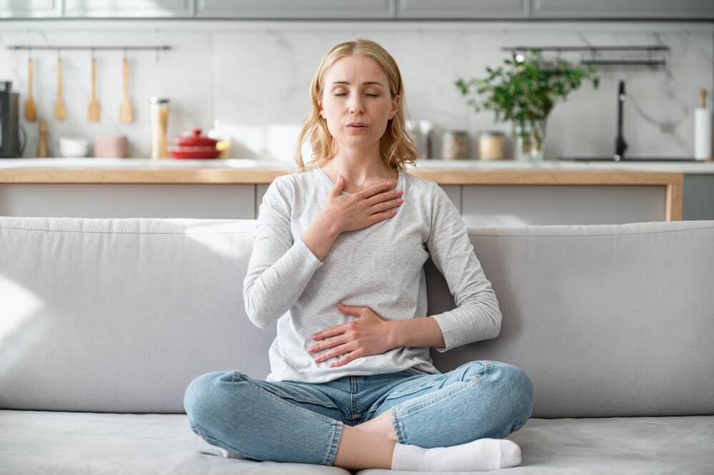 woman taking deep breaths