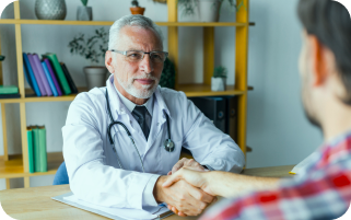 old age doctor shaking hand with the patient